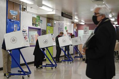 Voters fill in their ballots at a polling place in New York on Nov. 2, 2021. On Tuesday, Nov. 2, 2021.
