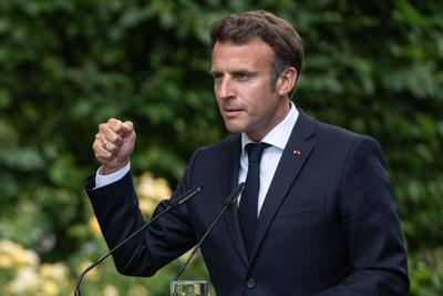 France's President Emmanuel Macron gestures during a press conference on June 16, 2022.