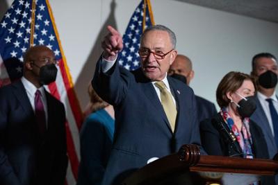 Senate Majority Leader Chuck Schumer speaks to reporters during a press conference regarding the Democratic party's shift to focus on voting rights at the Capitol in Washington, Tuesday, Jan. 18, 2022.
