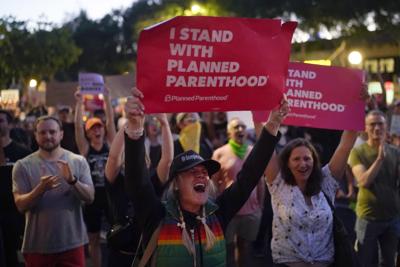 Supporters of abortion rights chant slogans outside a Planned Parenthood clinic during a protest in West Hollywood, Calif., Friday, June 24, 2022.