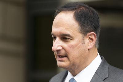 Michael Sussmann leaves a federal courthouse in Washington.
