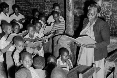 Sarah L. Murphy teaches children in a two-room schoolhouse in Rockmart, Ga. on June 23, 1950.