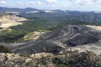 Coal trucks and heavy equipment move on the Middle Ridge surface coal mine, which cut off part of Coal River Mountain in Raleigh County, in southern West Virginia.