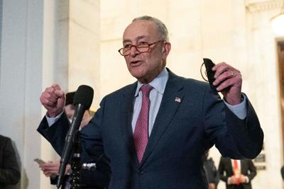 Senate Majority Leader Chuck Schumer speaks to the media after Senate Democrats met privately with President Joe Biden on Thursday, Jan. 13, 2022, on Capitol Hill.