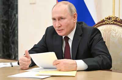 Russian President Vladimir Putin attends a meeting on economic issues via videoconference in Moscow, Russia, Thursday, Feb. 17, 2022. (Alexei Nikolsky, Sputnik, Kremlin Pool Photo via AP)