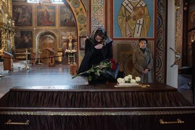 Close relatives and friends of Vira Hyrych pay their respects during the funeral service in St. Michaels Cathedral on May 3, 2022 in Kyiv, Ukraine.