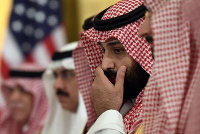 Saudi Arabia's Crown Prince Mohammed bin Salman listens during his meeting with then-President Donald Trump in Osaka, Japan, June 29, 2019.