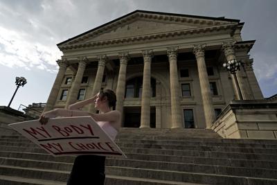 Kansas’ “Value Them Both” amendment on Tuesday’s ballot doesn’t ban abortion, but it clears a path for the state Legislature to do so.