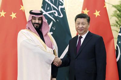 Saudi Crown Prince Mohammad bin Salman, left, shakes hands with Chinese President Xi Jinping before their meeting at the Great Hall of the People in Beijing, on Feb. 22, 2019.