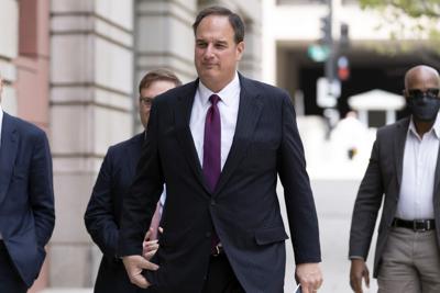 Michael Sussmann arrives at federal court in Washington, Wednesday, April 27, 2022.