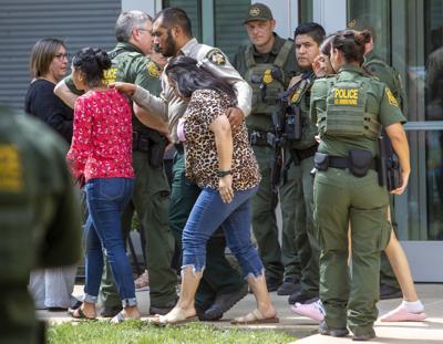People leave the Uvalde Civic Center following a shooting earlier in the day at Robb Elementary School, Tuesday, May 24, 2022, in Uvalde, Texas.