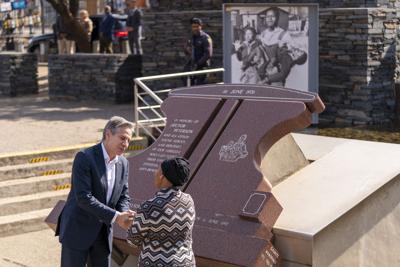 Secretary of State Antony Blinken greets Antoinette Sithole, the sister of the late Hector Pieterson, as he visits the Hector Pieterson Memorial in Soweto, South Africa, Sunday, Aug. 7, 2022.