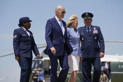 President Joe Biden walks with first lady Jill Biden at Andrews Air Force Base, Md., on Wednesday, May 18, 2022.