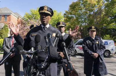 Washington Metropolitan Police Chief Robert Contee III speaks to reporters near the Peruvian ambassador's residence in northwest Washington.