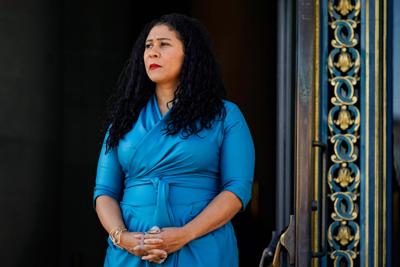 San Francisco Mayor London Breed listens during a COVID-19 briefing outside City Hall in San Francisco, Calif. on Dec. 1, 2021.