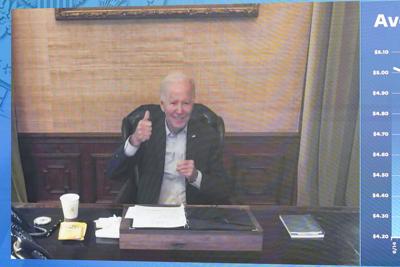 President Joe Biden gives a thumbs up after being asked by members of the media how he is feeling as he speaks virtually. (AP Photo/Andrew Harnik)