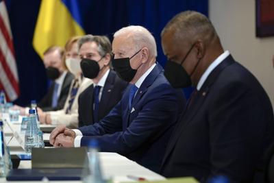 President Joe Biden, Defense Secretary Lloyd Austin, right, and Secretary of State Antony Blinken, third from right, participate in a meeting with Ukrainian Foreign Minister Dmytro Kuleba and Ukrainian Defense Minister Oleksii Reznikov on March 26, 2022...