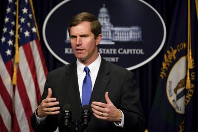 Kentucky Democratic Gov. Andy Beshear speaks to the press.