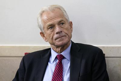 Peter Navarro listens as President Donald Trump speaks during a news conference at the White House, on Aug. 14, 2020, in Washington.