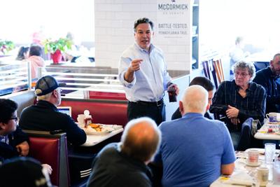 David McCormick, a Republican candidate for U.S. Senate in Pennsylvania, meets with attendees during a campaign event at the Round the Clock Diner in York, Pa.