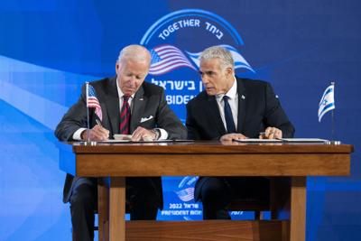 President Joe Biden and Israeli Prime Minister Yair Lapid sign a joint declaration in Jerusalem, Thursday, July 14, 2022.