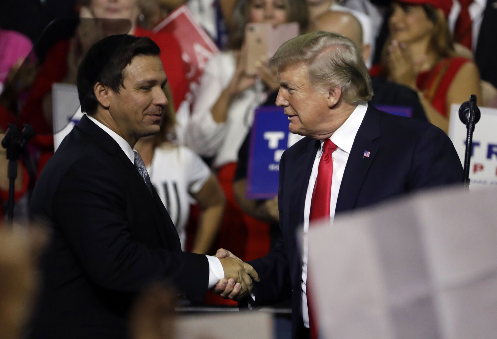 A new poll out of New Hampshire shows Florida Gov. Ron DeSantis, left, running a couple of points ahead of Donald Trump among GOP voters.