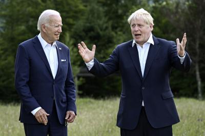 Britain's Prime Minister Boris Johnson, right, and US President Joe Biden, left, in the past had differences over both style and substance, and some of the damage was done long before Biden was president.