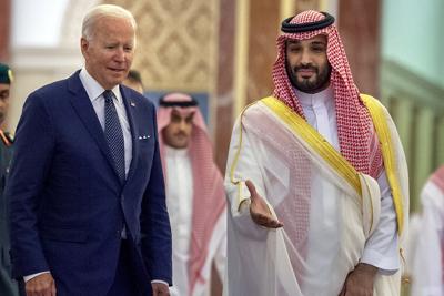 In this photo released by the Saudi Royal Palace, Saudi Crown Prince Mohammed bin Salman, right, welcomes President Joe Biden upon his arrival at Al-Salam palace in Jeddah, Saudi Arabia on July 15, 2022.