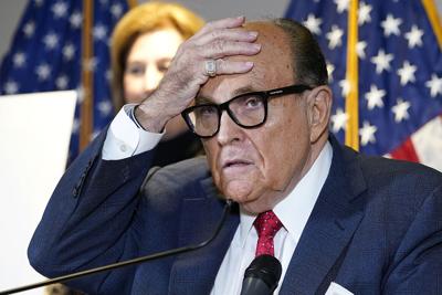 Rudy Giuliani speaks during a news conference.