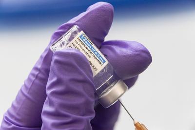 A health care worker loads a syringe with the Covid-19 Johnson & Johnson Janssen vaccine on March 26, 2021 in Buffalo, W.Va.