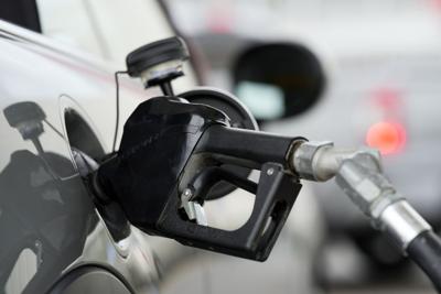 A motorist dispenses gasoline from a pump in May 2022.