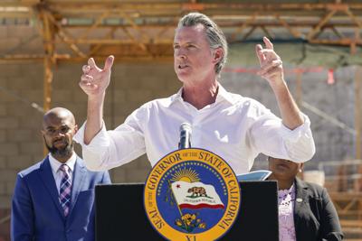 Governor Gavin Newsom talks to reporters during a press conference at the construction site of a water desalination plant in Antioch, Calif., Aug. 11, 2022.