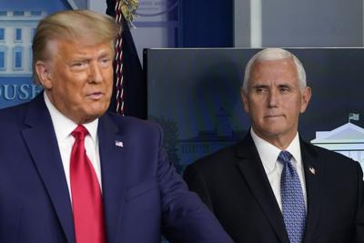 Vice President Mike Pence, right, listens as President Donald Trump, left, makes a statement from the briefing room at the White House in Washington, Tuesday, Nov. 24, 2020.