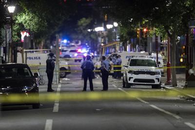 Philadelphia Police officers and detectives look over evidence at the scene of a shooting in Philadelphia on June 5.
