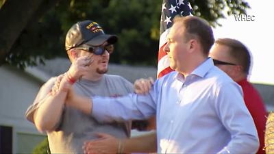 In this image taken from video provided by WHEC-TV, David Jakubonis, left, brandishes a sharp object as he attacks U.S. Rep. Lee Zeldin, right, as the Republican candidate for New York governor delivered a speech in Perinton, N.Y., Thursday, July 21, 2022.