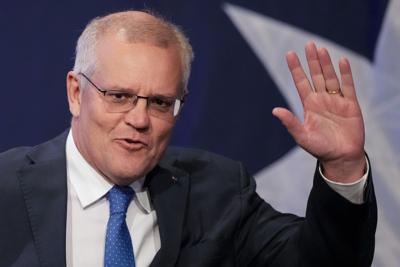 Australian Prime Minister Scott Morrison waves as he arrives at a Liberal Party function in Sydney, Australia, Saturday, May 21, 2022.