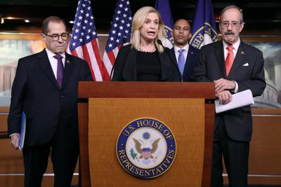 Rep. Carolyn Maloney (D-N.Y.) speaks at a news conference as Rep. Jerry Nadler (D-N.Y.), left, listens on Oct. 31, 2019 in Washington, D.C.