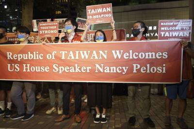 Supporters hold a banner outside the hotel where U.S. House Speaker Nancy Pelosi is supposed to be staying in Taipei, Taiwan on Aug 2.
