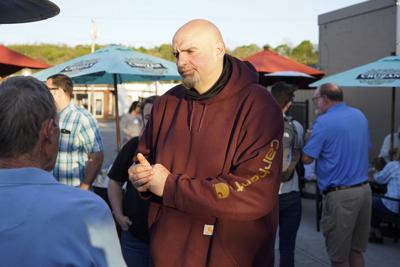 John Fetterman greets supporters at a campaign stop, May 10, 2022, in Greensburg, Pa.