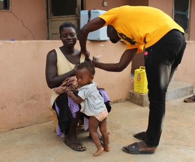 A woman receives the Covid-19 vaccine in the Biakoye district, Ghana, on April 23, 2022.