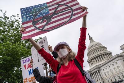 Activists join Senate Democrats outside the Capitol to demand action on gun control legislation after a gunman killed 19 children and two teachers at a Texas elementary school this week, in Washington, Thursday, May 26, 2022.