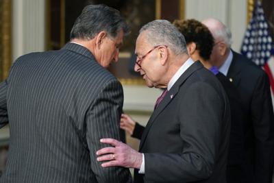 Sen. Joe Manchin and Majority Leader Chuck Schumer announced a last-minute tax deal Wednesday.