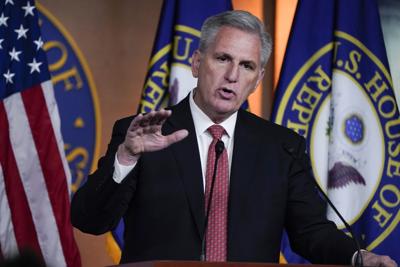 House Minority Leader Kevin McCarthy responds to reporters at the Capitol.