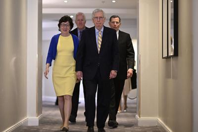 Senate Minority Leader Mitch McConnell, joined by fellow Republican senators, prepares to meet with media in Stockholm on Sunday, one day after his delegation's visit with Ukrainian President Volodymyr Zelenskyy in Kyiv.