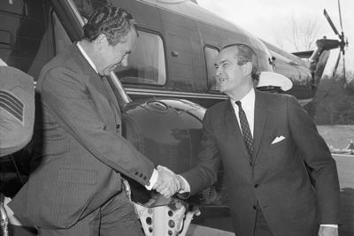 U.S. President Richard Nixon shakes hands with CIA Director Richard Helms on March 7, 1969.