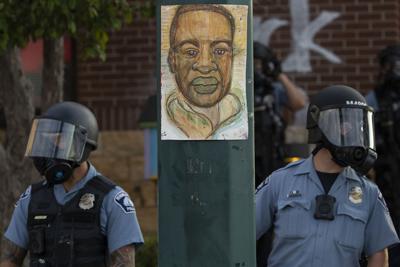 Minneapolis police stand outside the department's 3rd Precinct on May 27, 2020, in Minneapolis.