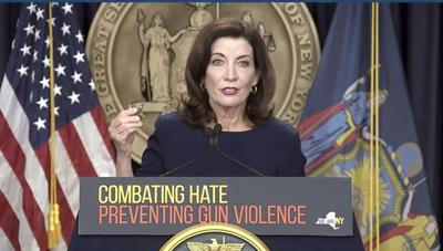 In this image taken from video, New York Gov. Kathy Hochul shows bullets similar to those used in the Buffalo supermarket shooting during a news conference on May 18, in New York.