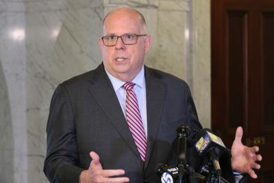 Maryland Gov. Larry Hogan talks to reporters.