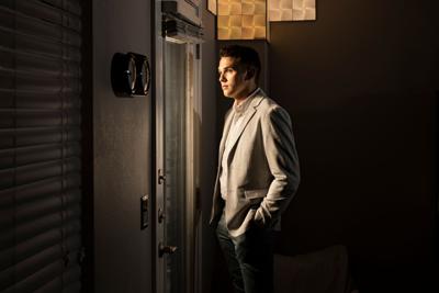 Andrew Hartzler poses for a portrait at his apartment in Tulsa, Okla. on March 23, 2022.
