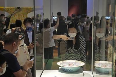 Visitors tour the Hong Kong Palace Museum during the first day open to public in Hong Kong, Sunday, July 3, 2022.